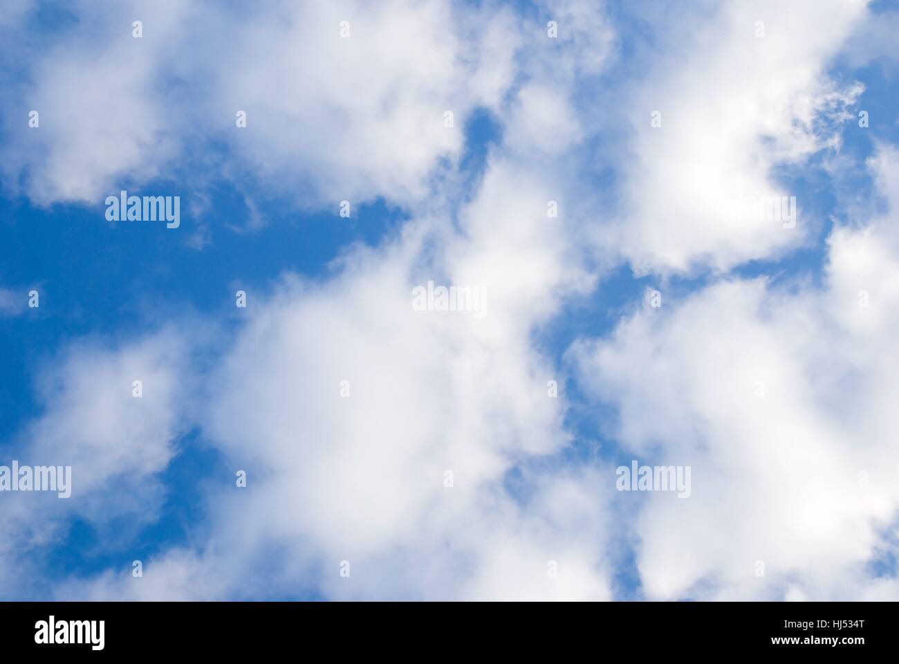 a blue sky with many white clouds Stock Photo - Alamy