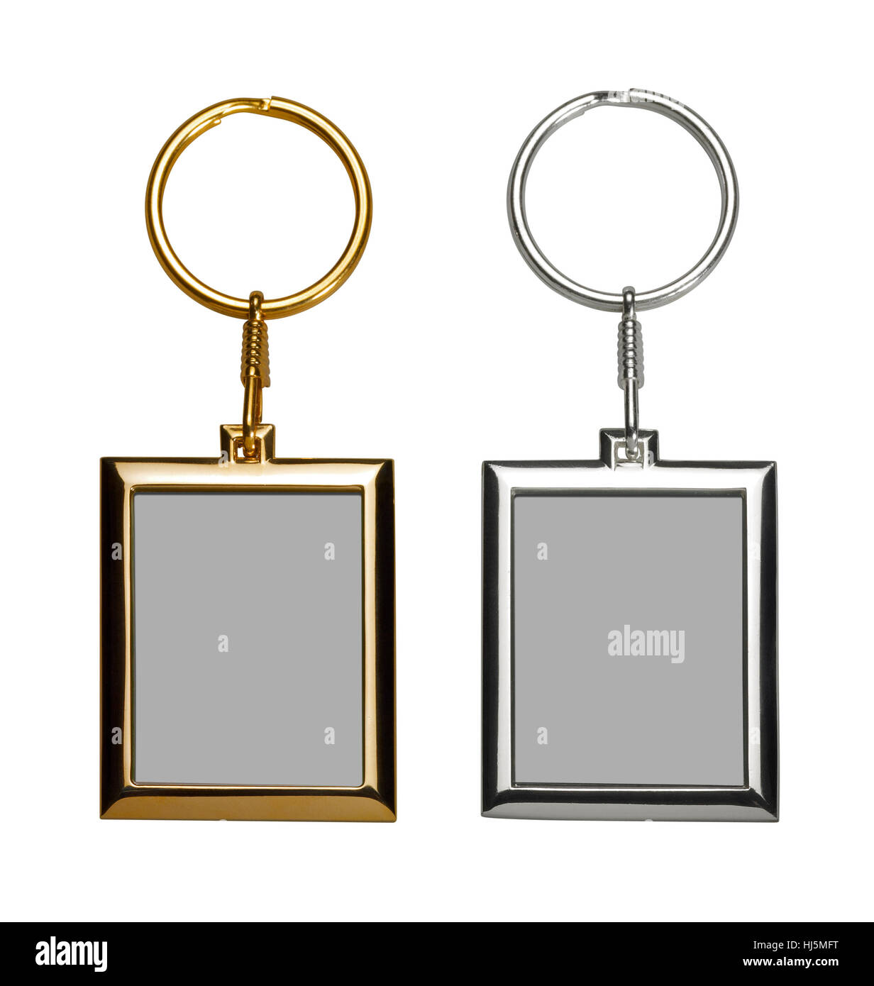 two gold and silver colored keychains with picture frame Stock Photo
