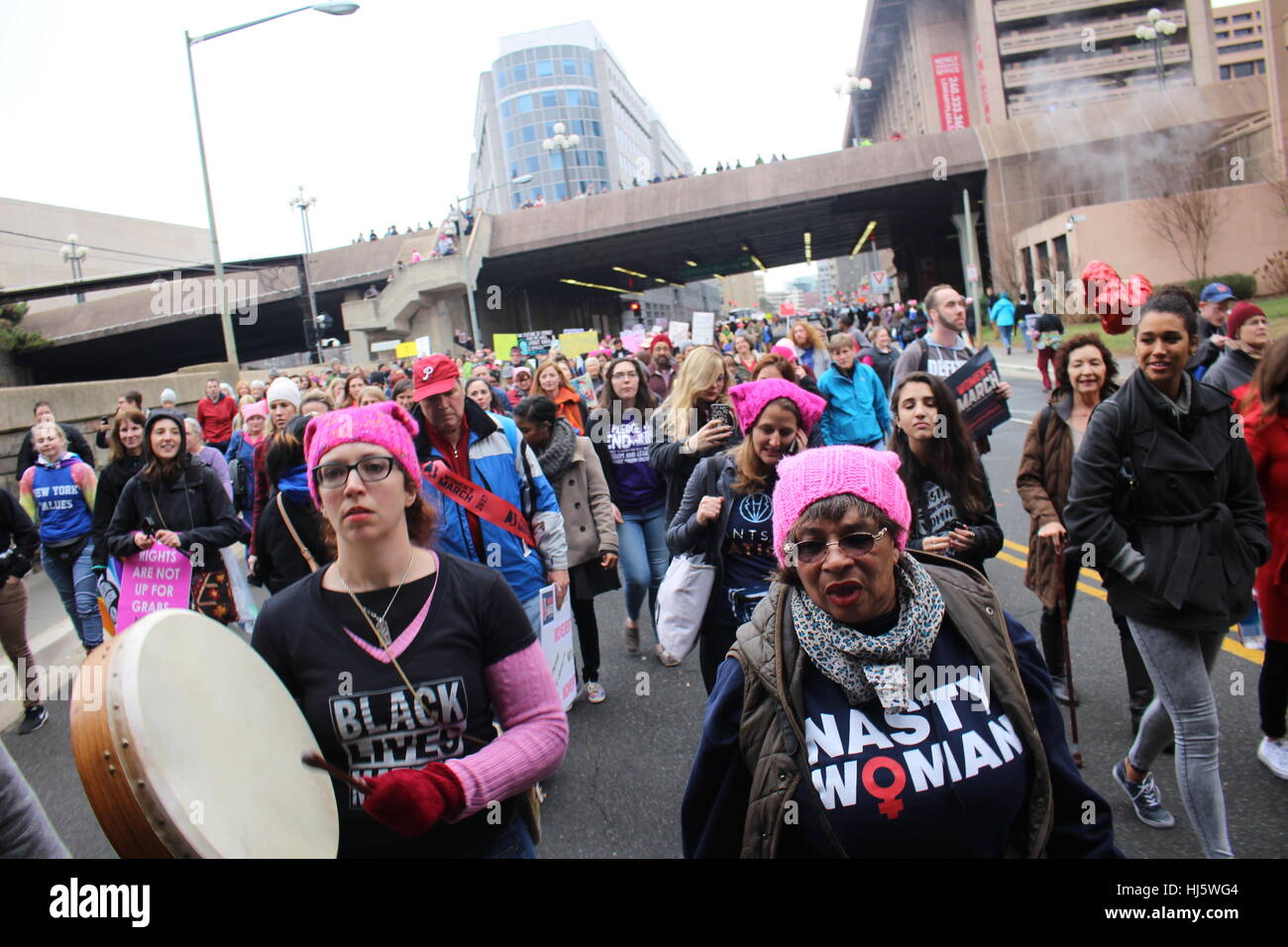 District of Columbia, USA. 21 Jan, 2017. Protesters march along Independence Avenue SW, including a woman beating a buffalo drum. Stock Photo