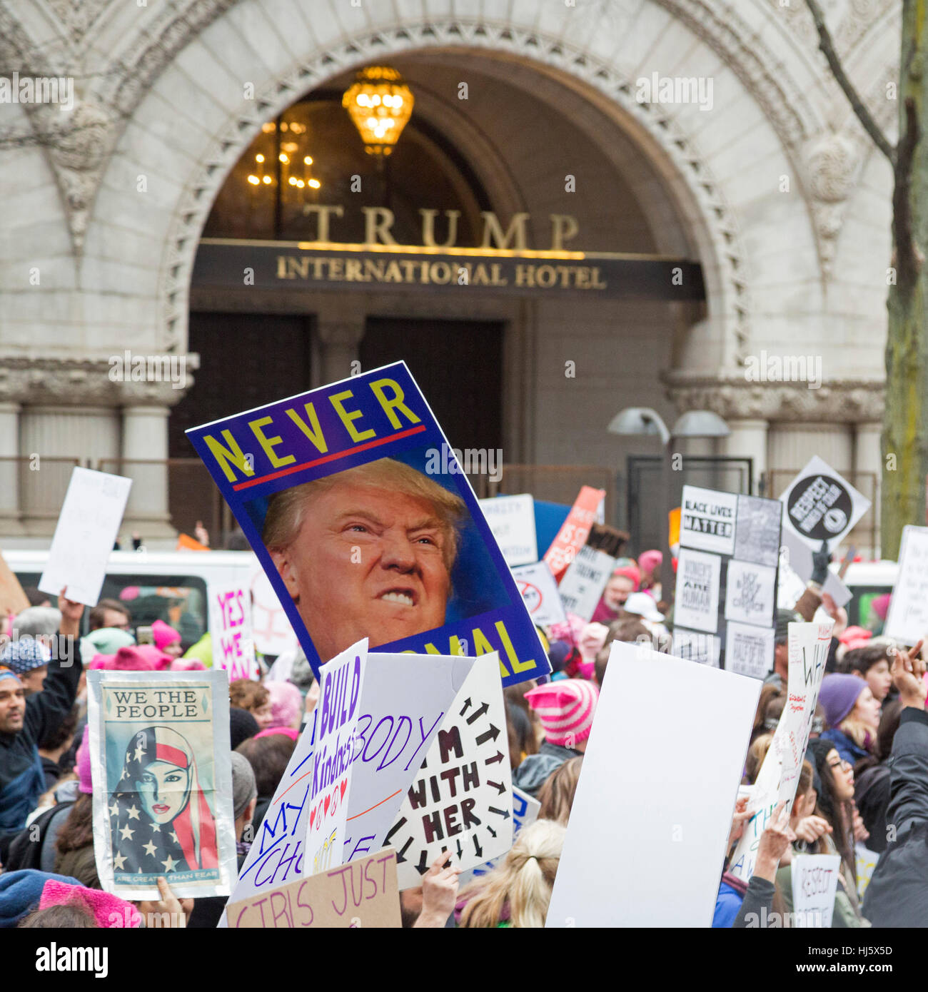 Washington, DC USA - 21 January 2017 - The Women's March on Washington drew an estimated half million to the nation's capitol to protest President Donald Trump. It was a far larger crowd than had witnessed his inauguration the previous day. Marchers passed the Trump International Hotel near the White House. Credit: Jim West/Alamy Live News Stock Photo