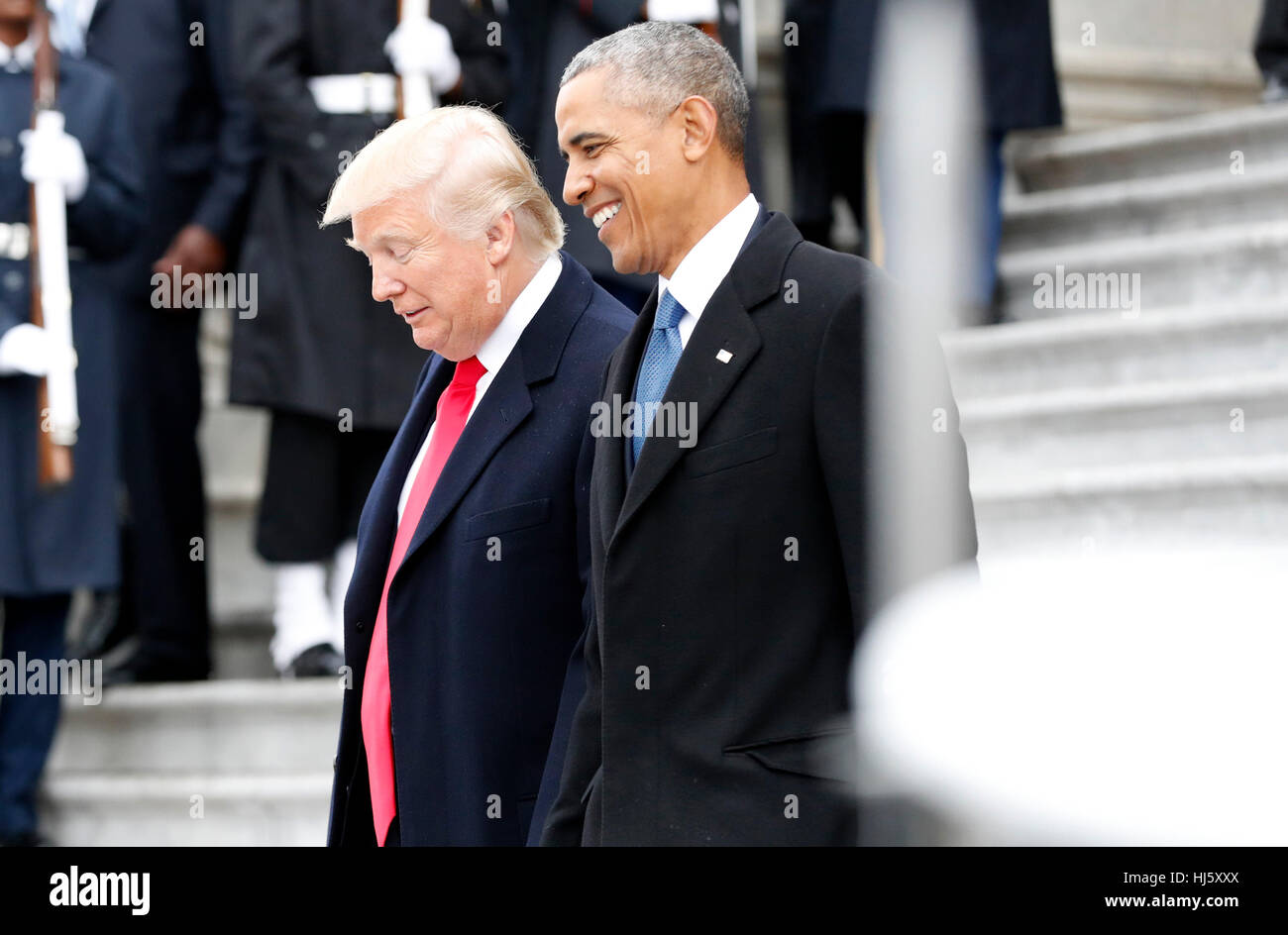 Former President of the United States Barack Obama and United States President Donald Trump smile as they walk down the east front steps of the Capitol Building after Trump is sworn in at the 58th Presidential Inauguration on Capitol Hill in Washington, DC on January 20, 2017. Credit: John Angelillo/Pool via CNP /MediaPunch Stock Photo