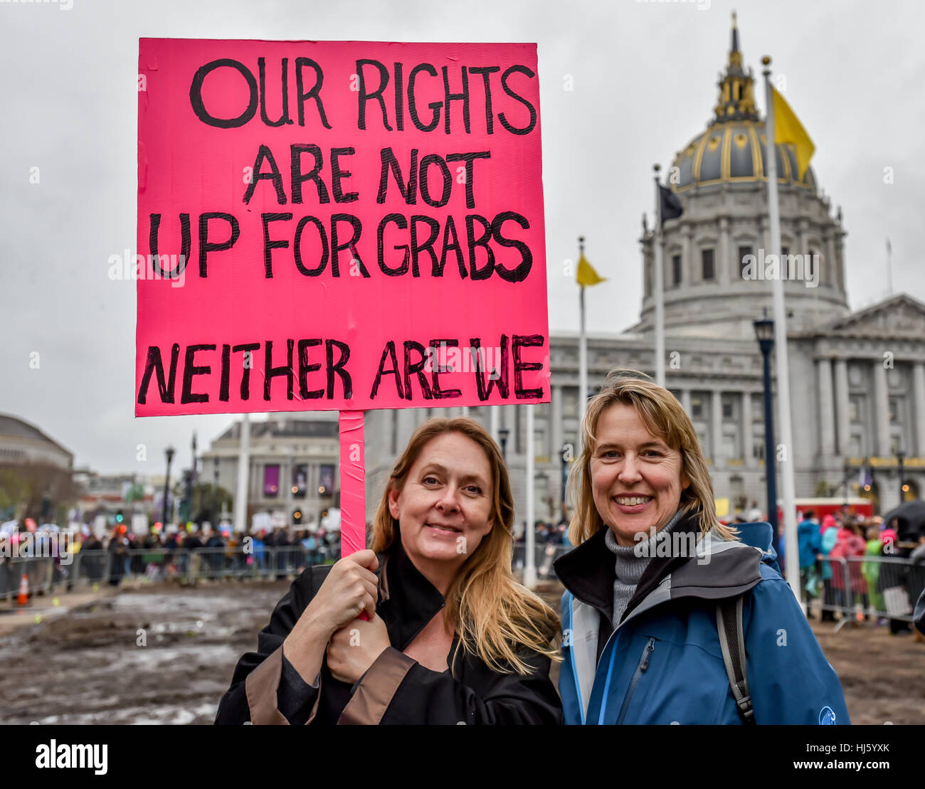 San Francisco, California, USA. 21st January, 2017. Two women hold sign in front of San Francisco Cit Hall that, 'Our rights are not up for grabs. Neither are we,' before San Francisco Women's March 2017. Credit: Shelly Rivoli/Alamy Live News Stock Photo