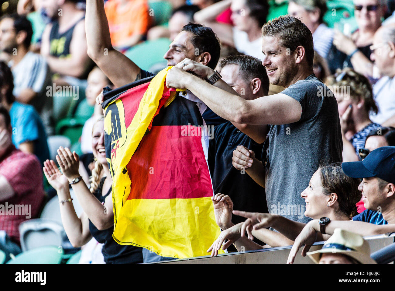 German fans celebrate Mischa Zverev of Germany who ousts world number one Andy Murray during the 2017 Tennis Australian Open at Melbourne Park Stock Photo