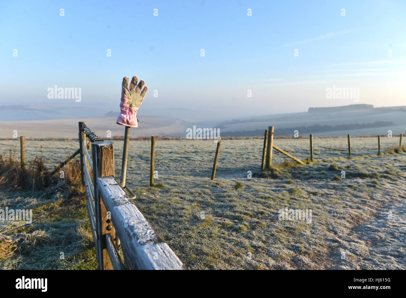 Brighton Sussex, UK. 22nd Jan, 2017. An abandoned glove on a frosty and misty morning on the South Downs near Brighton as the cold weather continues throughout southern Britain with temperatures forecast to drop to minus 5 centigrade in some areas Credit: Simon Dack/Alamy Live News Stock Photo