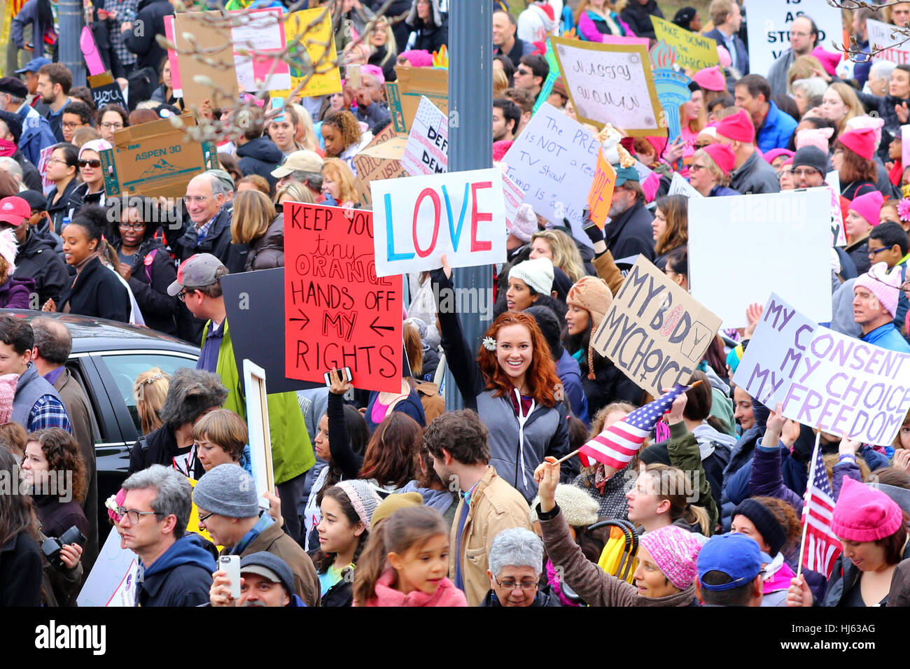 Washington, DC, USA. 21st January, 2017. A woman holds a sign, 'LOVE' amidst a sea of people in the March on Washington. January 21, 2017. Stock Photo