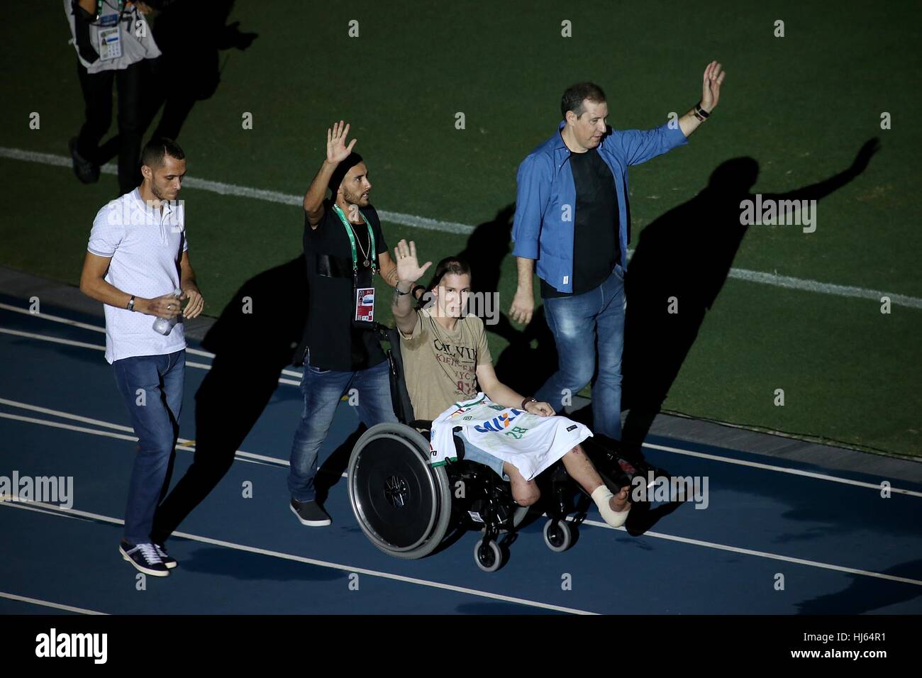 Rio De Janeiro, Brazil. 25th Jan, 2017. Brazilian Chapecoense footballers Alan Ruschel (2nd L), Neto (1st L) and Jackson Follmann (2nd R), and journalist Rafael Henzel (1st R), survivors of the LaMia airplane crash in Colombia, enter the pitch before a friendly match between Brazil and Colombia at the Engenhao Stadium in Rio de Janeiro, Brazil, on Jan. 25, 2017. All the net income of the match will be passed on to the Chapecoense Football Association. Credit: Li Ming/Xinhua/Alamy Live News Stock Photo