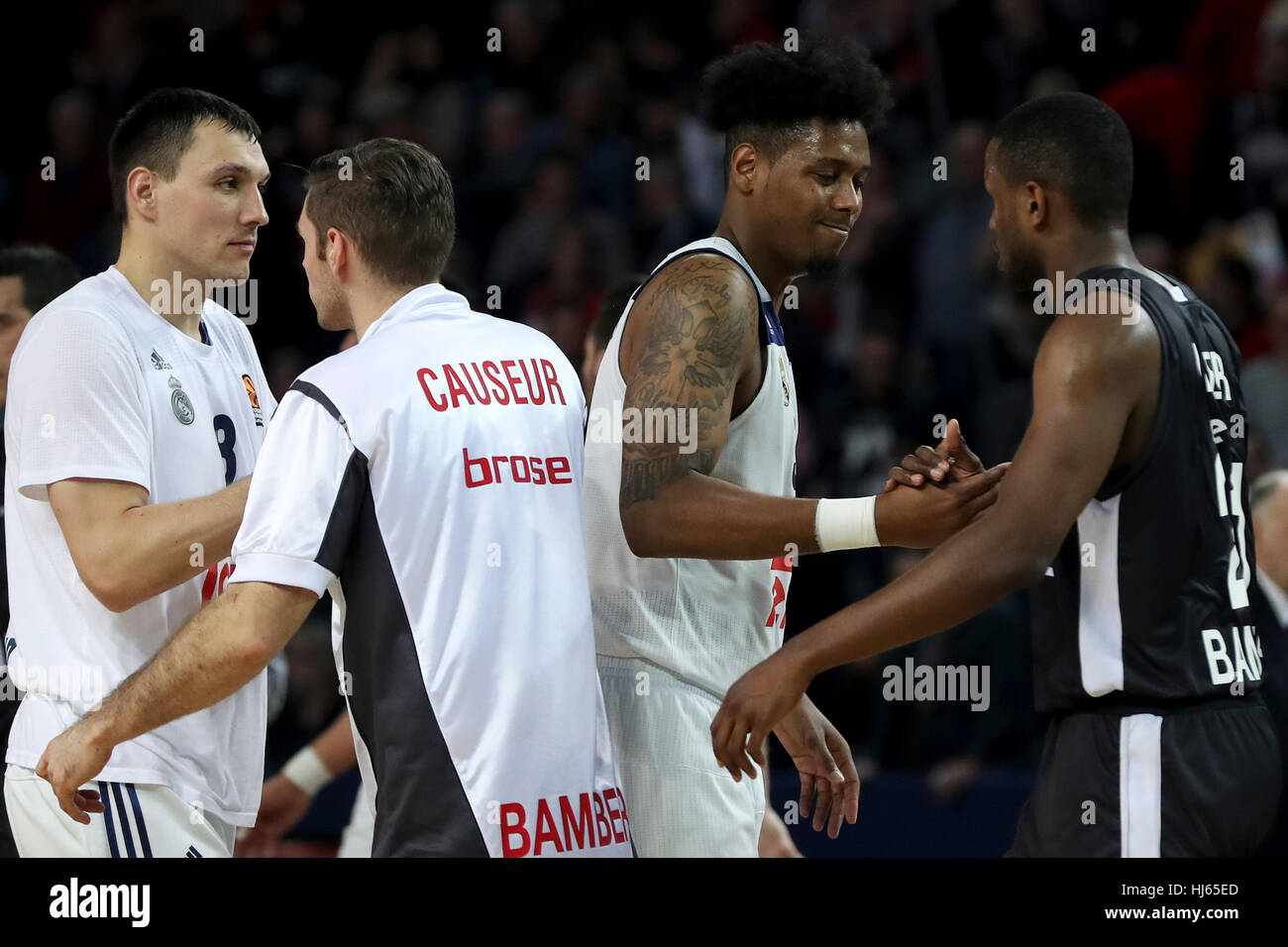 Nuremberg, Germany. 25th Jan, 2017. Bamberg's Fabien Causeur (2.f.L.) and Darius Miller (R) shake hands with Madrid's Jonas Maciulis (L) and Trey Thompkins after the Euroleague basketball game between Brose Bamberg and Real Madrid in the Arena Nuernberg in Nuremberg, Germany, 25 January 2017. Photo: Daniel Karmann/dpa/Alamy Live News Stock Photo