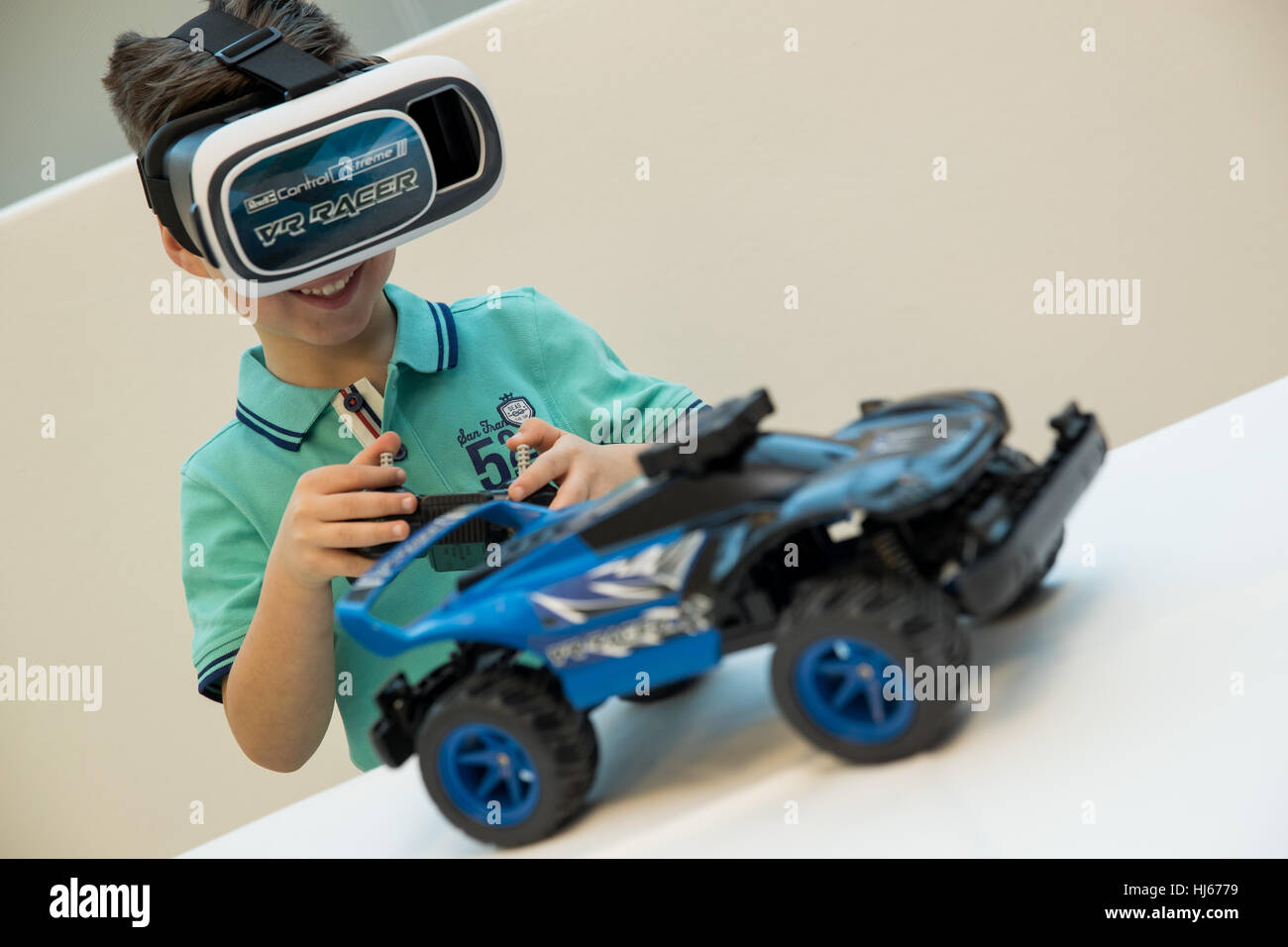 Romeo plays with the 'Revell Control X-treme Raver VR Racer' from Revell  during the press conference for the Spielwarenmesse 2017 toy fair in the  exhibition center in Nuremberg, Germany, 26 January 2017.