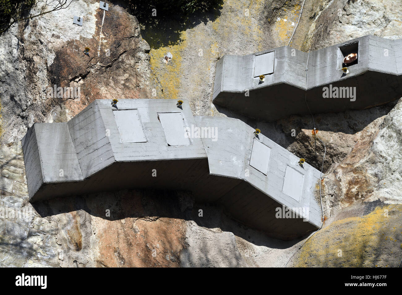 Anchors in concrete prevent the rocks from slipping below the bergfried