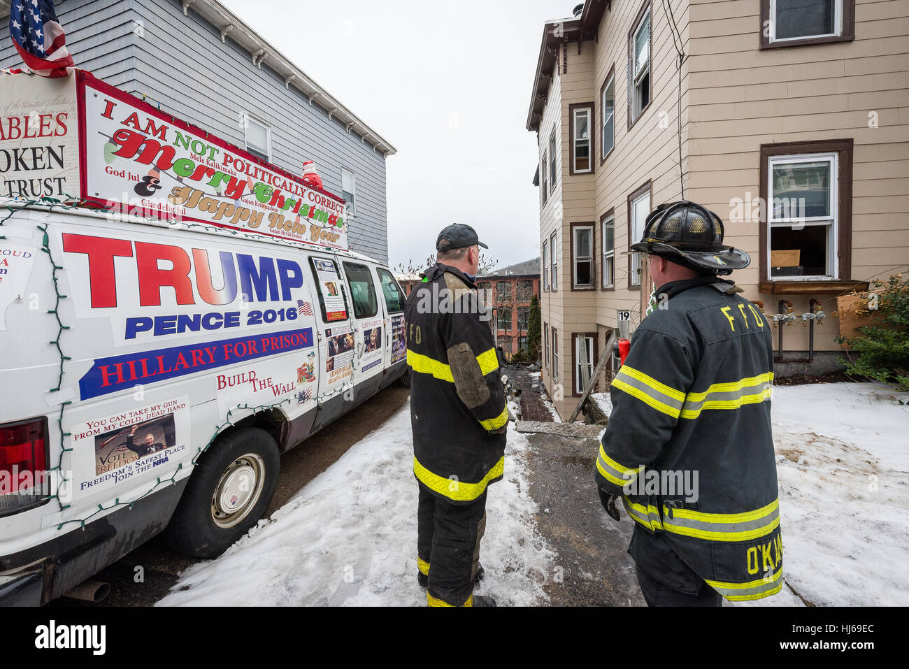 Fitchburg, Massachusetts, USA. 26th Jan, 2017. Firefighters look on at 2nd fire at the 'Trump House' at 19-21 West St in Fitchburg Mass. A fire on December 22nd was deemed accidental due to smoking materials in an outside couch. The building was unoccupied at the time of this morning's fire which was reported around 6:00 am. Credit: Jim Marabello/ Alamy Live News Stock Photo