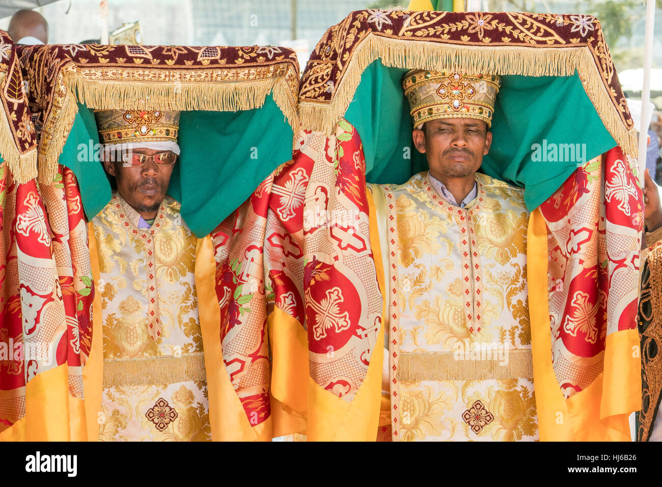 Addis Ababa - Jan 19: Priests, accompanied by Clergy, carry the Tabot, a model of the Arc of Covenant, during a colorful procession of Timket celebrat Stock Photo
