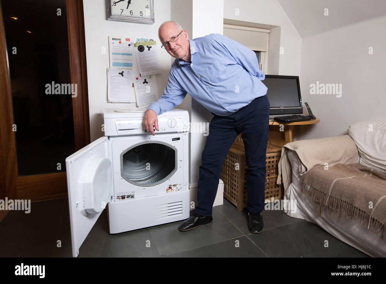 Owner of a Hotpoint tumble dryer manufactured by Whirlpool waits for replacement of unit believed to be affected by a fault which causes fire, England Stock Photo