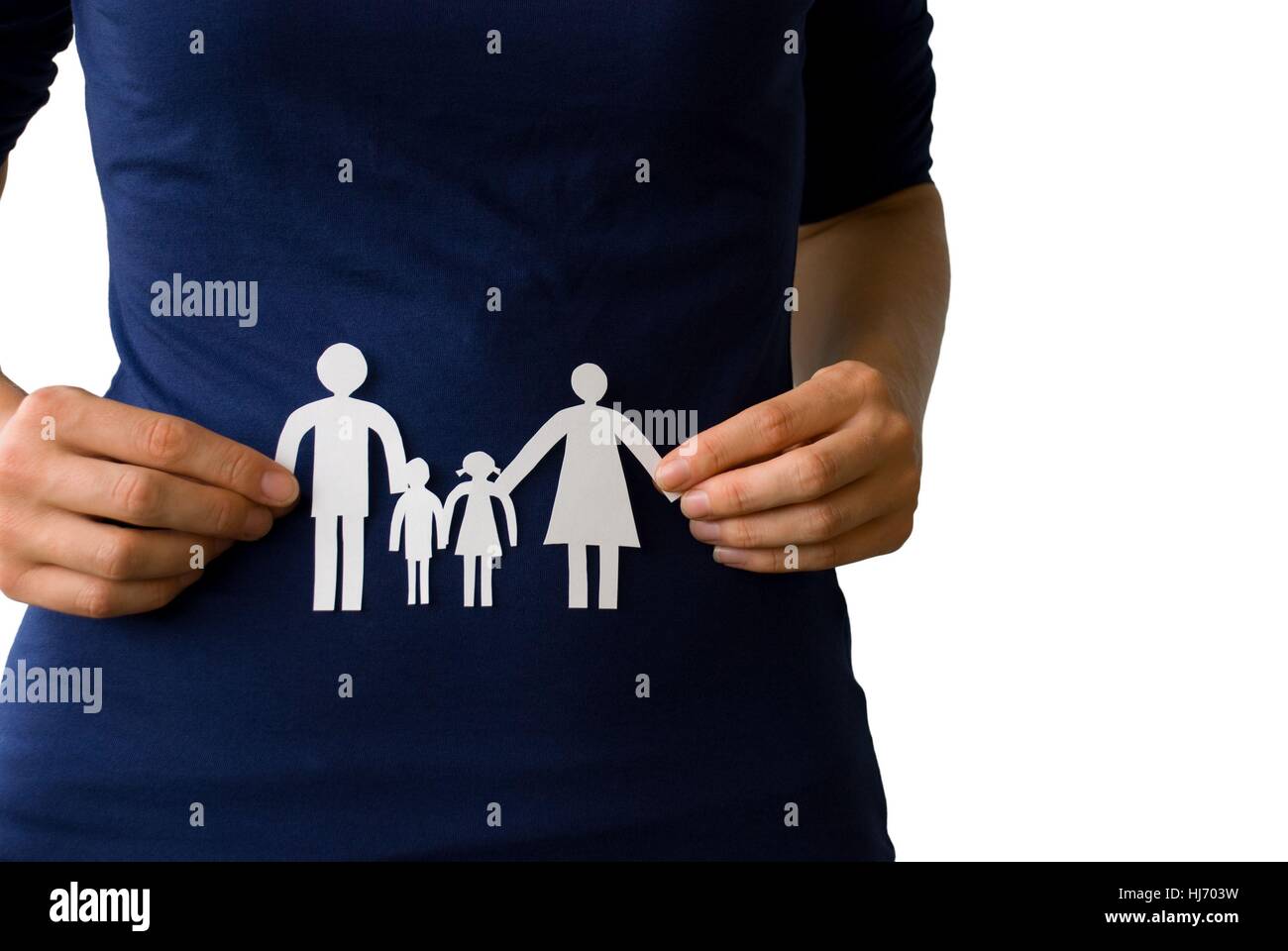 two hands holding a white paper chain family Stock Photo - Alamy