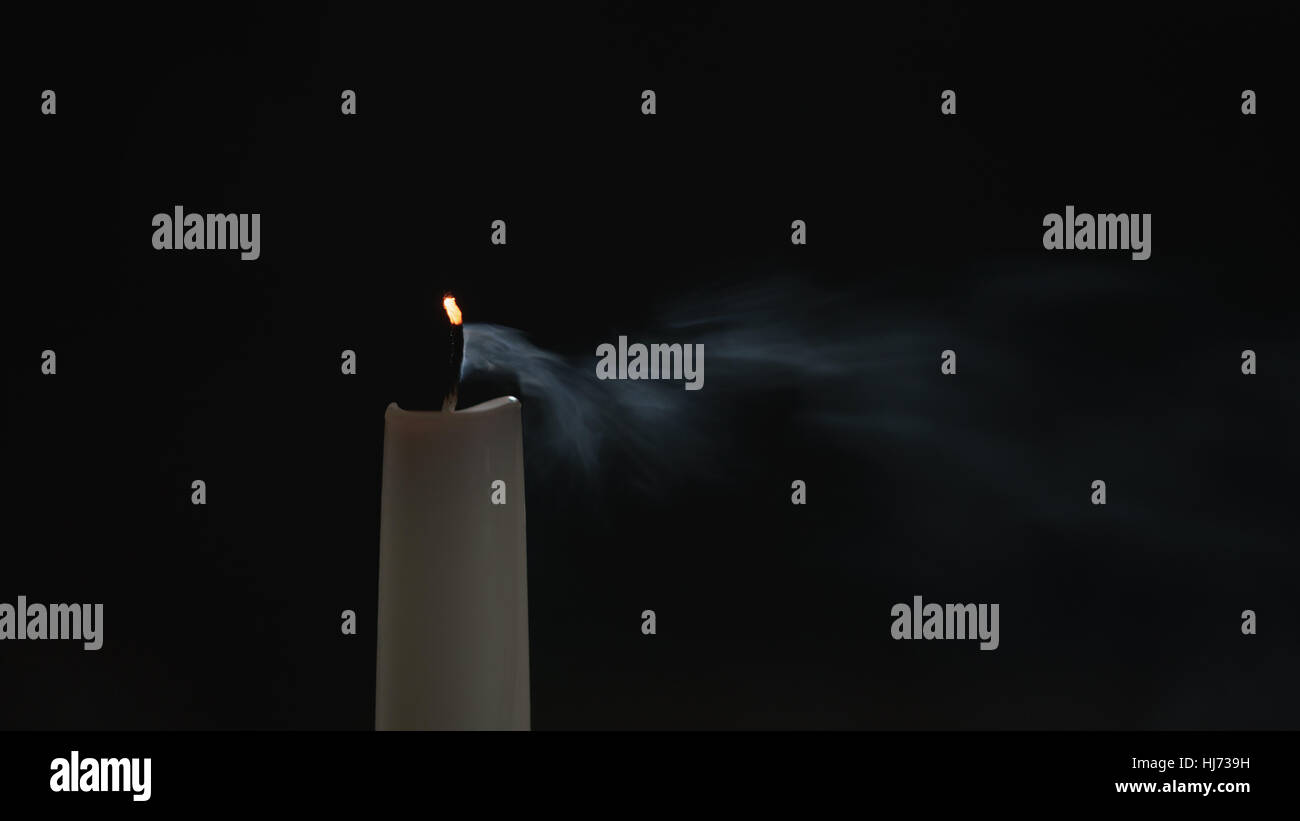 tall candle with smoke trail Stock Photo Alamy