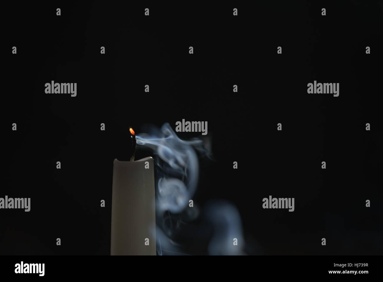 tall candle with smoke trail Stock Photo Alamy