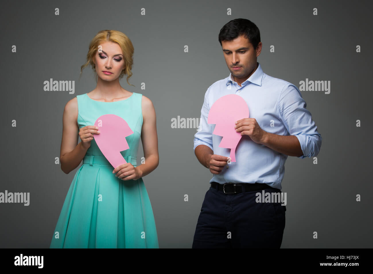 Beautiful couple holding pink broken heart Stock Photo