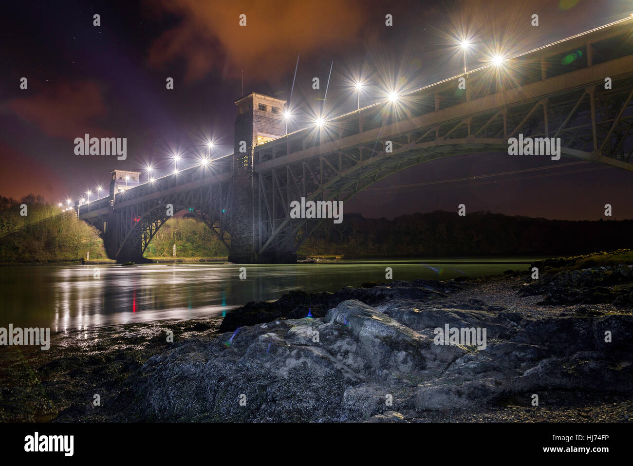 Britannia bridge Anglesey North Wales Uk landscape. night scene. reflections, rock lights. Stock Photo