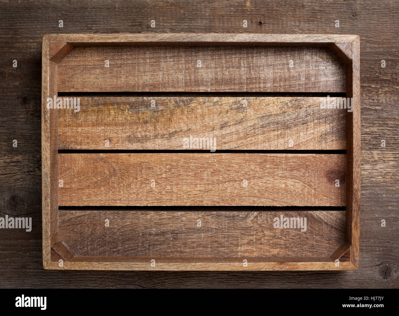 empty wooden box on old wooden background (top view, dark) Stock Photo
