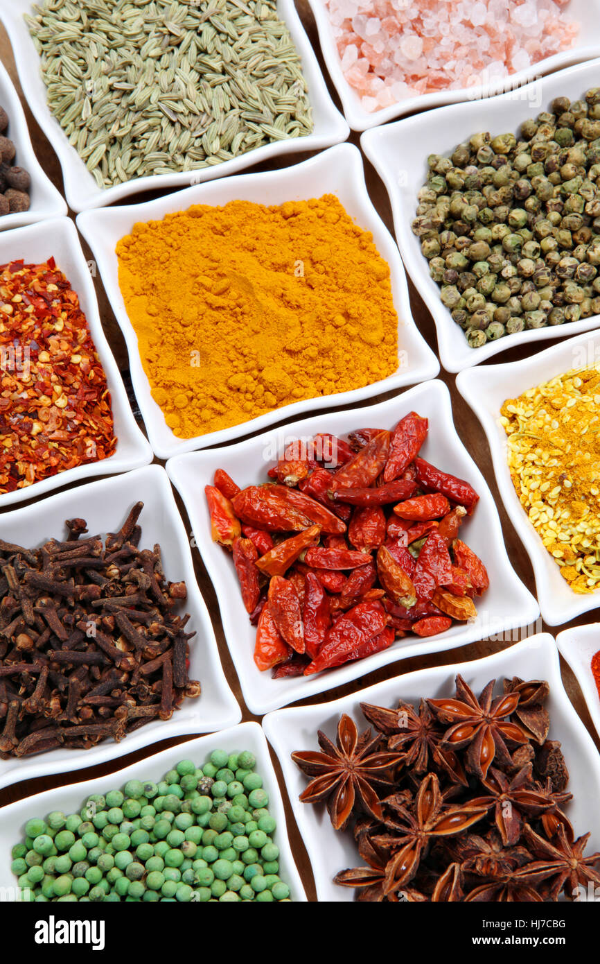 Assorted herbs and spice on a ceramics bowls. Stock Photo