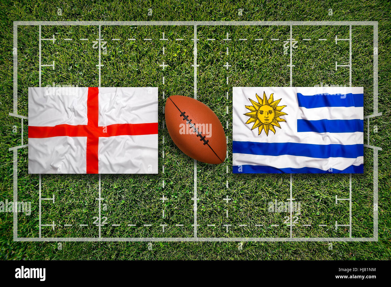 England vs. Uruguay flags on green rugby field Stock Photo