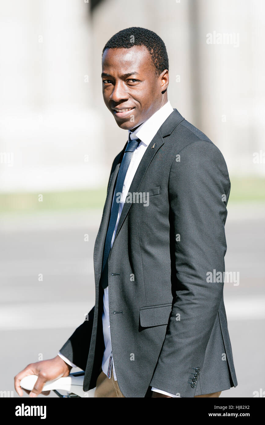 Portrait of Handsome young man smiling in the street Stock Photo - Alamy