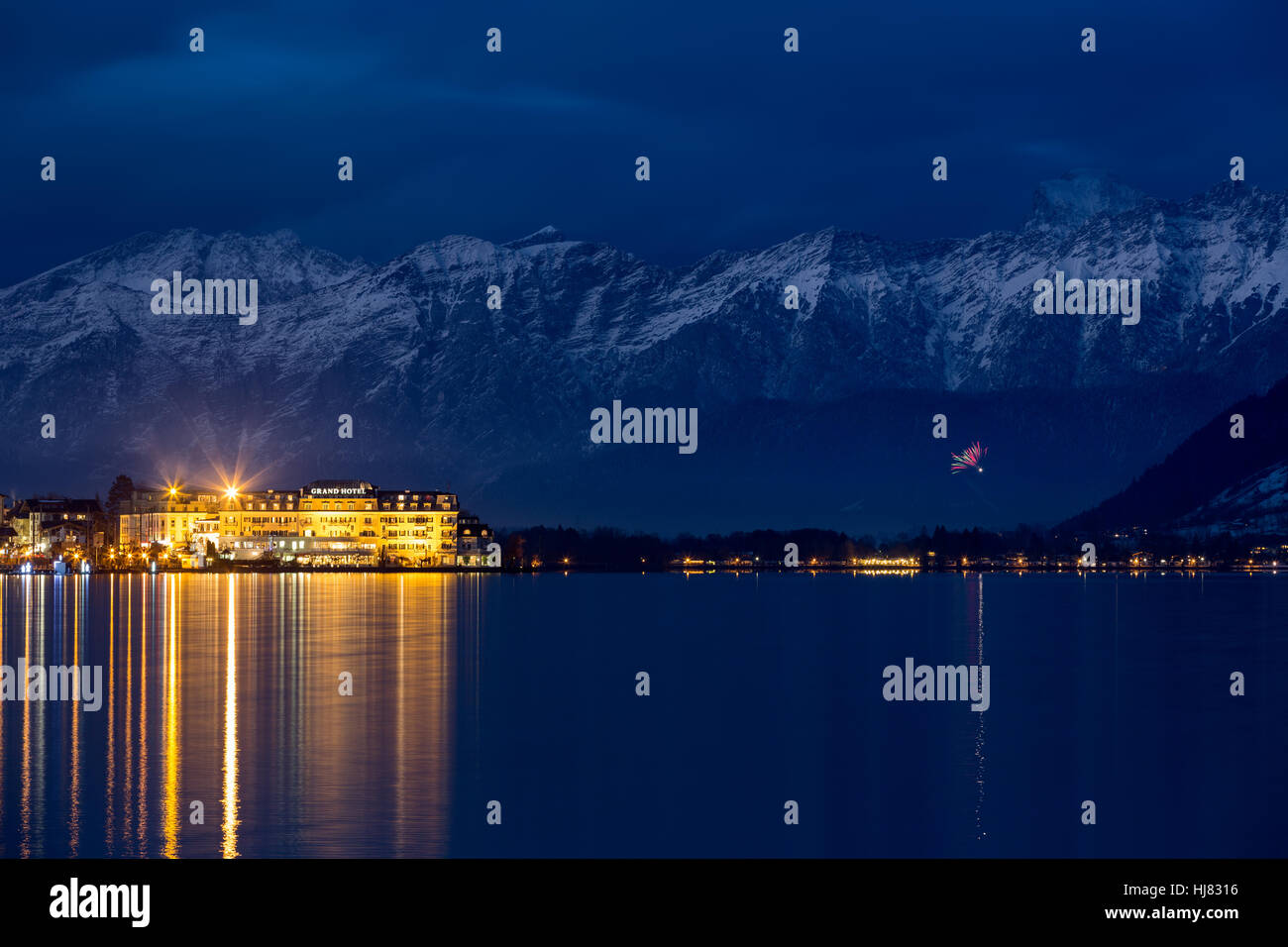ZELL AM SEE, AUSTRIA - JANUARY 05, 2016 - Grand Hotel in front of Steinernes Meer ('Rocky Sea') mountain range at wintertime Stock Photo
