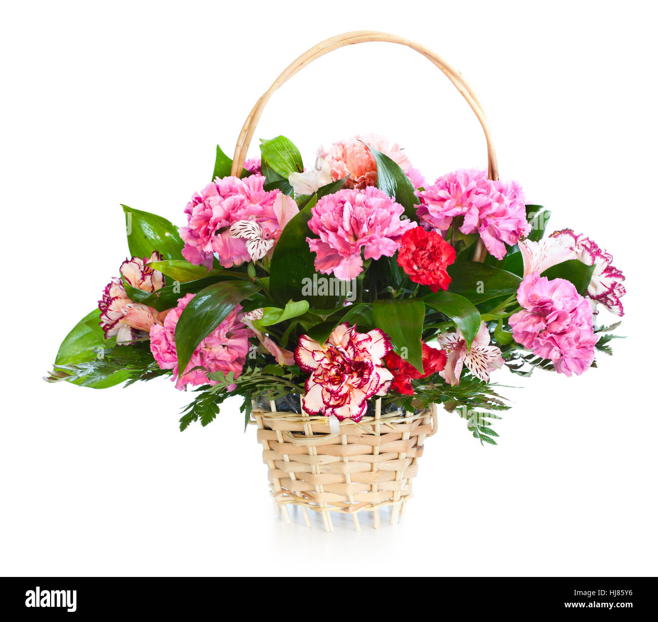 Bright flower bouquet in basket isolated on white background Stock