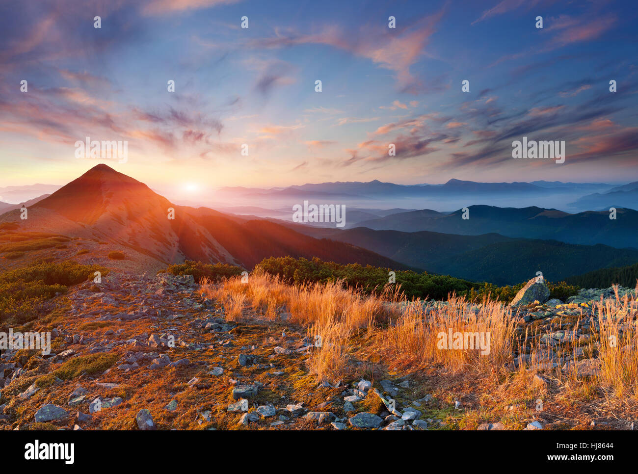 Colorful autumn landscape in the mountains. Sunrise Stock Photo