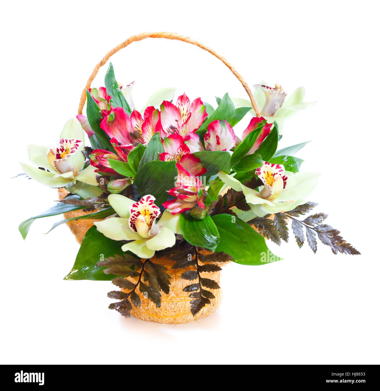 Bright flower bouquet in basket isolated over white background Stock