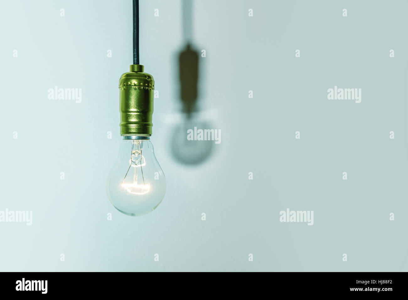 light bulb on green background Stock Photo - Alamy