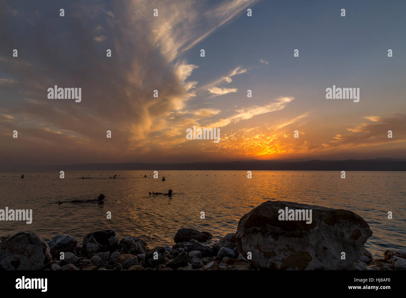 Sowayma Bathers at sunset with clouds, Sowayma, Dead Sea, Jordan Stock Photo ...