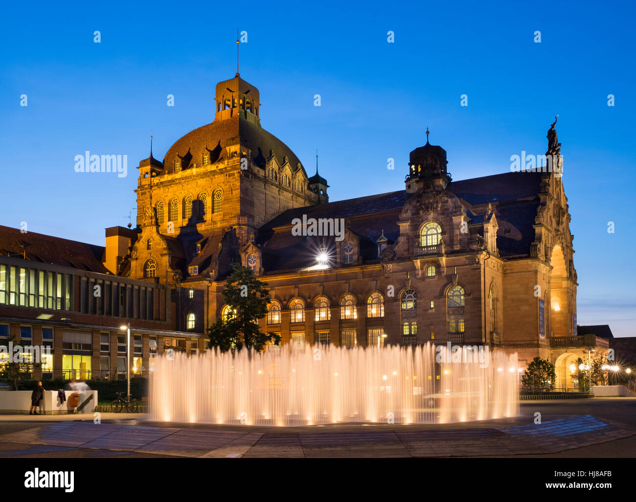 Opera House with illuminated fountain, dusk, Nuremberg, Middle Franconia, Franconia, Bavaria, Germany Stock Photo
