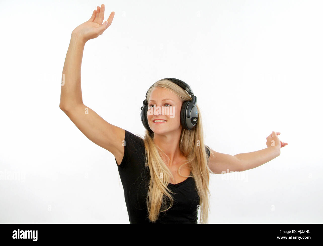 Young woman in motion to music Stock Photo - Alamy