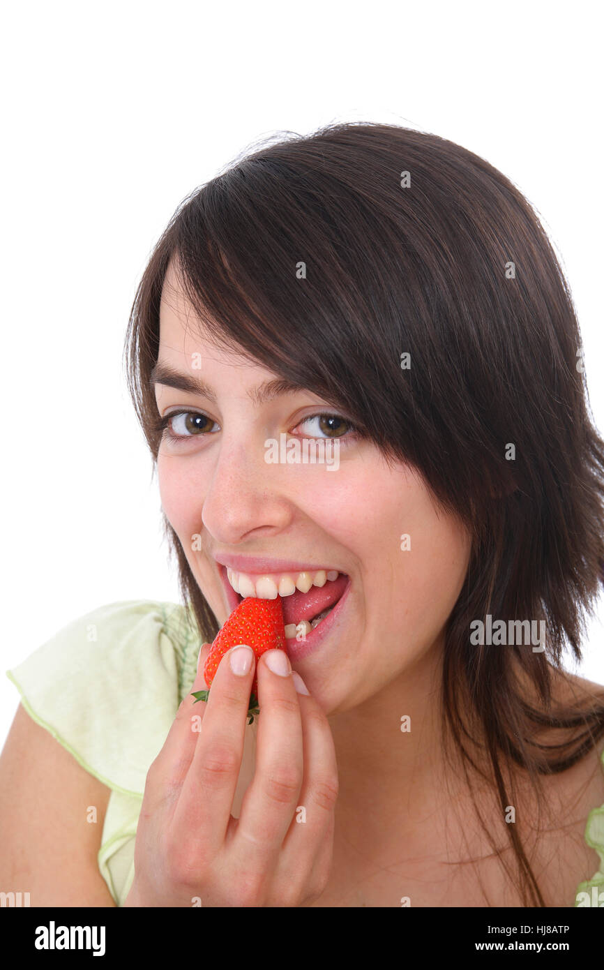 Young woman eats strawberry Stock Photo