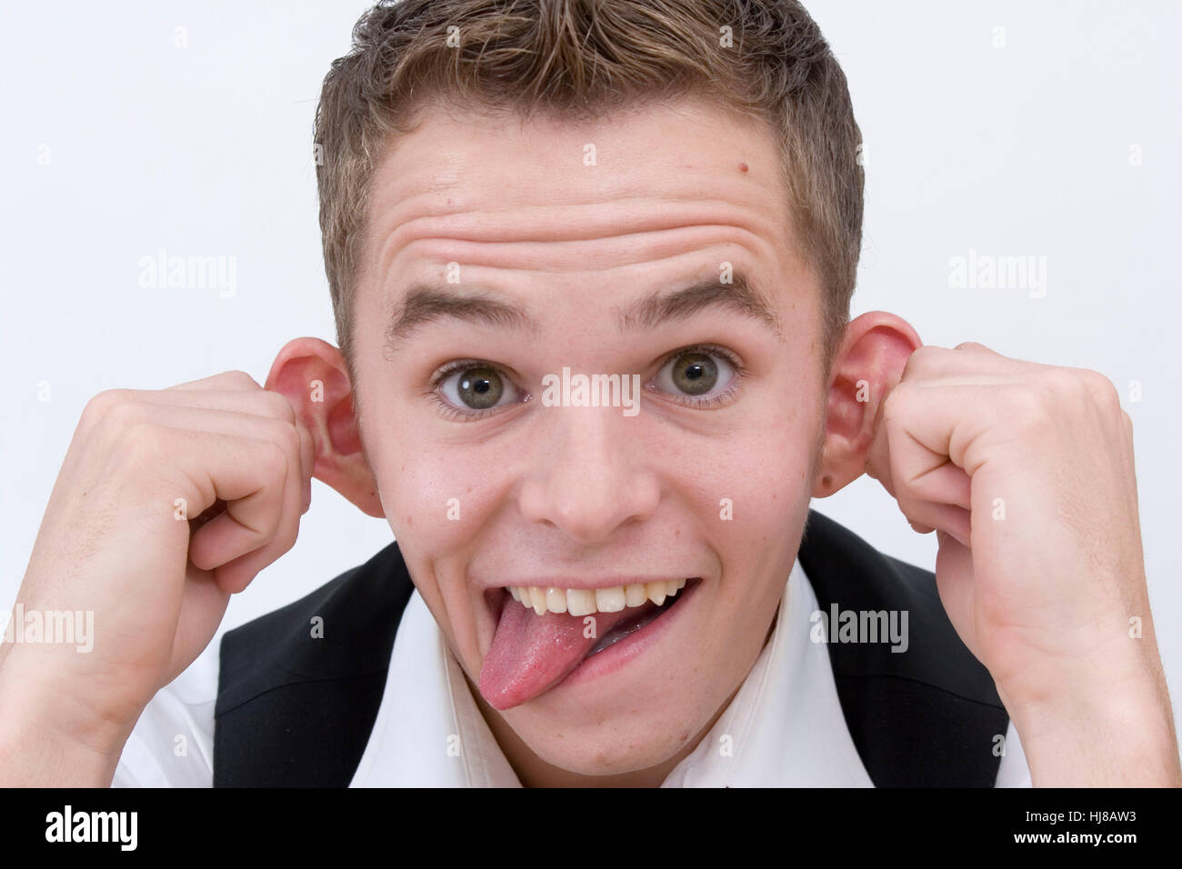 Young man pulls faces Stock Photo