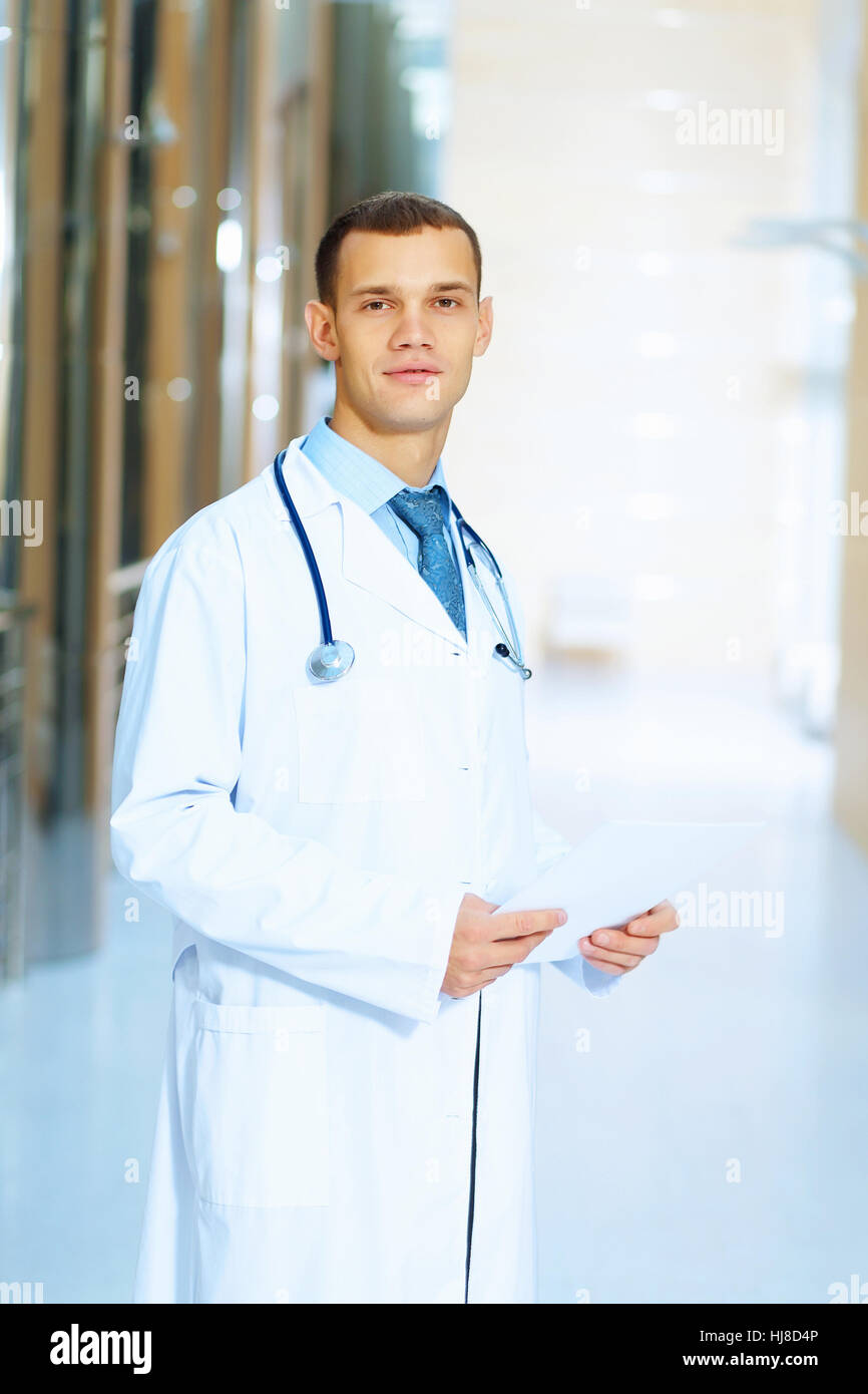 Smiling male doctor gp hi-res stock photography and images - Alamy
