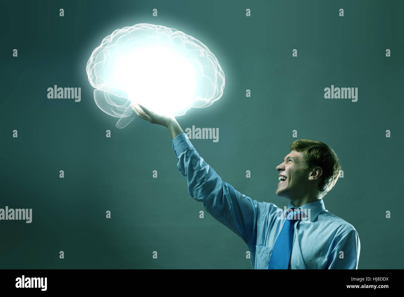 Young man holding 3d image of human brain in hand Stock Photo - Alamy