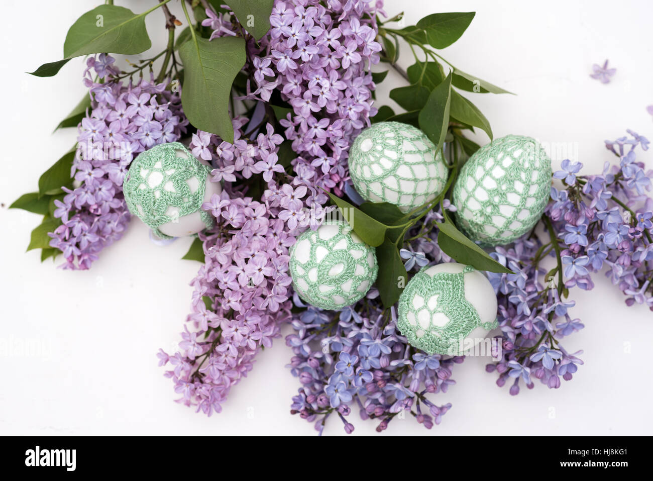 Handmade Easter eggs and Lilac flowers Stock Photo