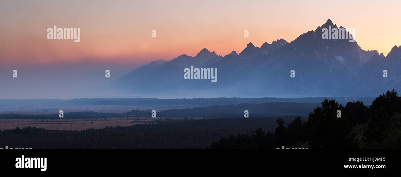 Forest fire smoke from the Berry Fire of 2016 engulfing the Teton Mountains and Jackson Hole. Grand Teton National Park, Wyoming Stock Photo