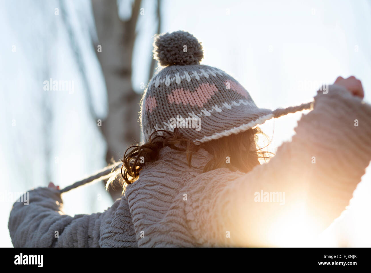 Girl pulling her string beanie hat Stock Photo Alamy