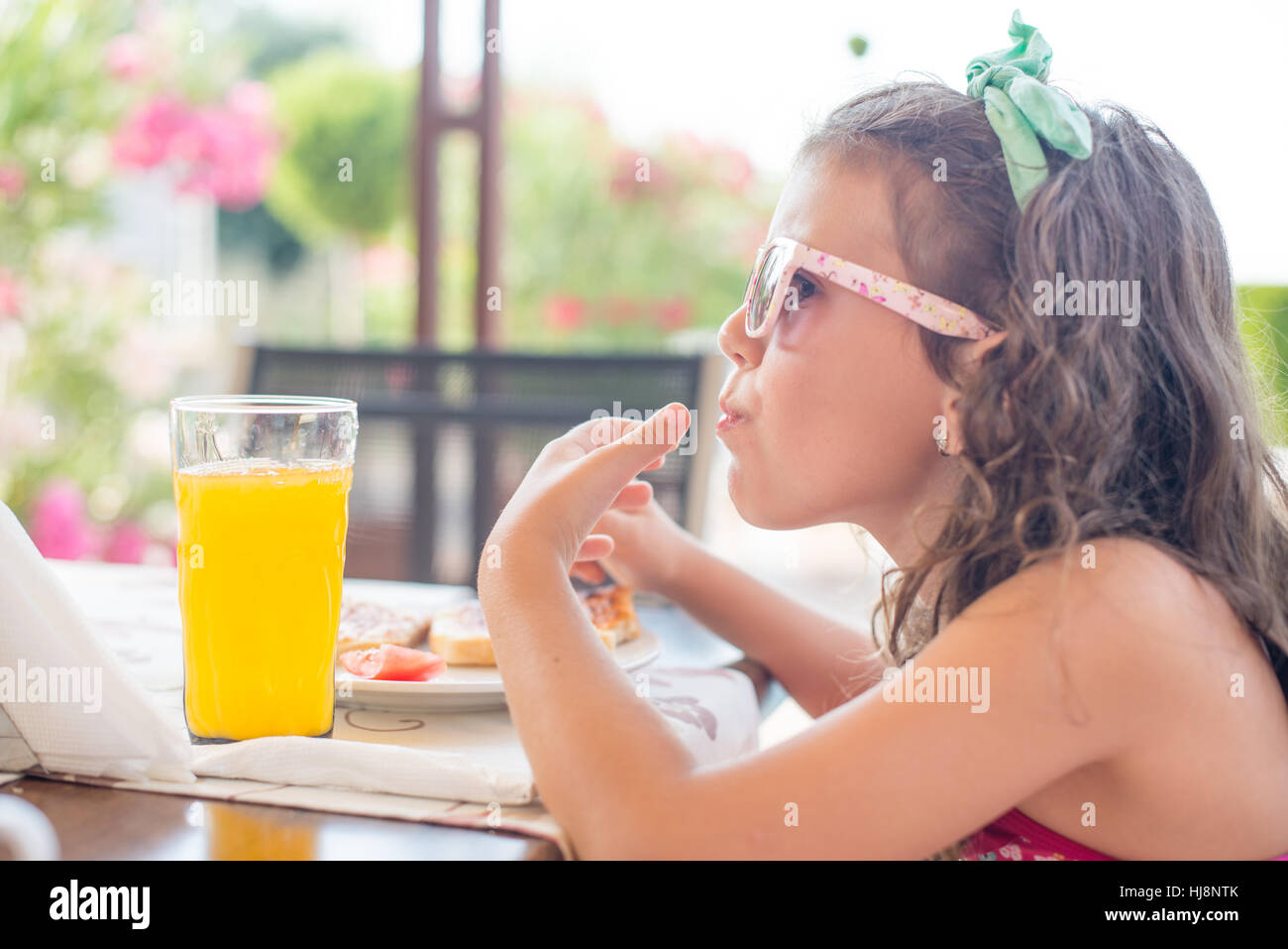 Girl on vacation eating breakfast Stock Photo