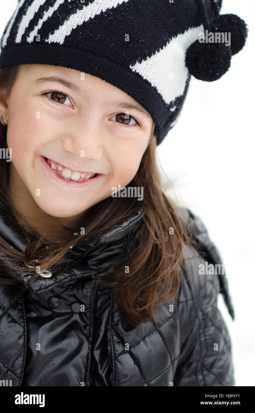 Portrait of a smiling girl in winter hat Stock Photo