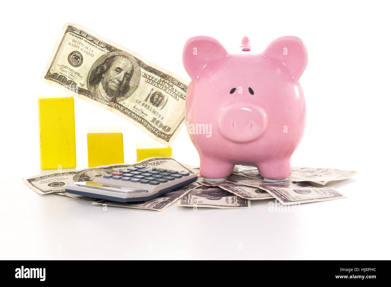 Pink piggy bank beside graph and calculator on white background Stock ...
