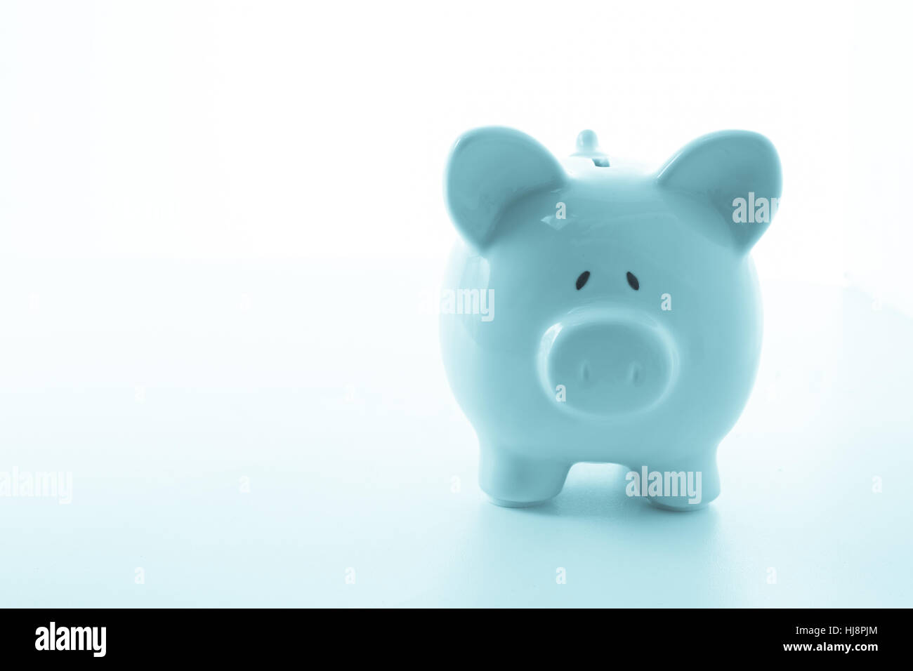 Ceramic blue piggy bank with copy space on white background Stock Photo ...