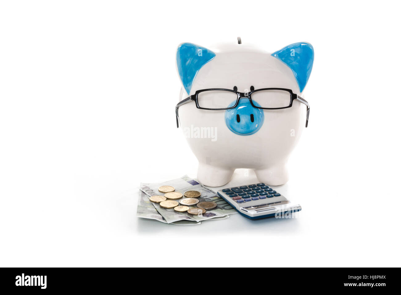 Piggy bank wearing glasses with calculator and cash on white background ...