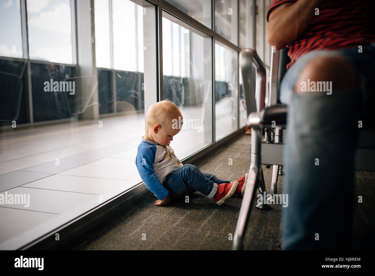 Boy leaning against window sleeping Stock Photo Alamy