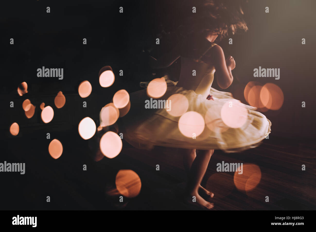 Girl twirling in party dress Stock Photo