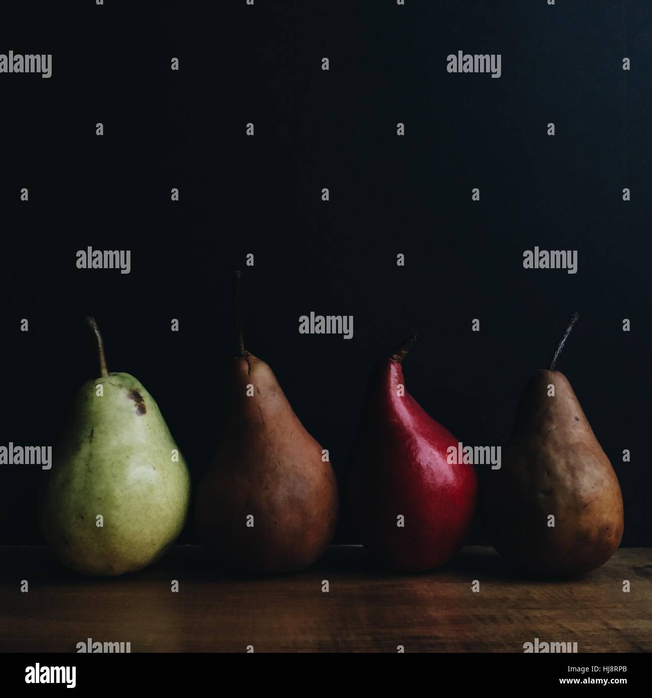 Four pears in a row Stock Photo