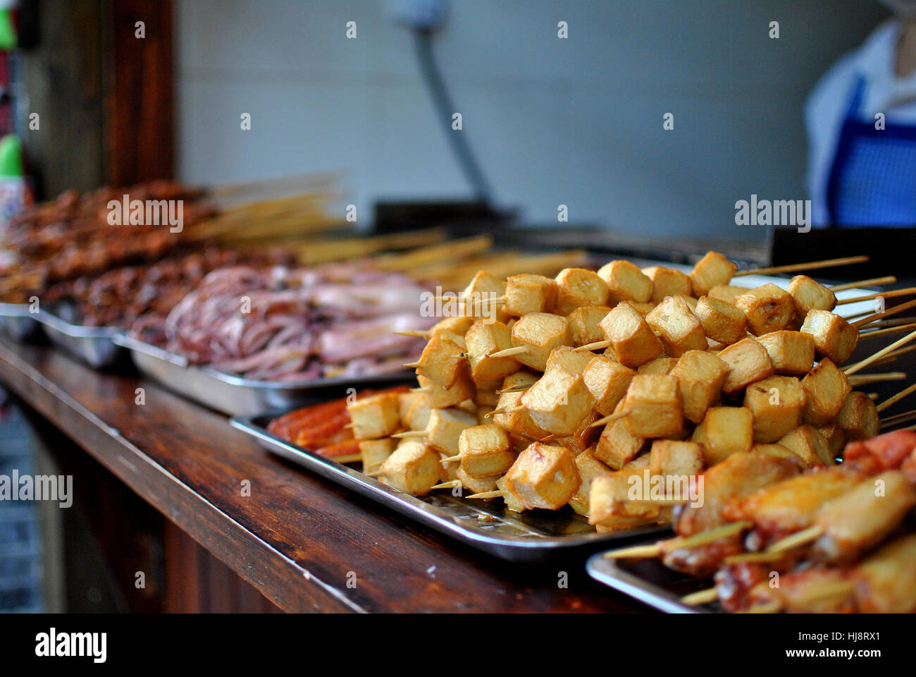 Tofu and meat skewers for sale in street market, Chengdu, China Stock