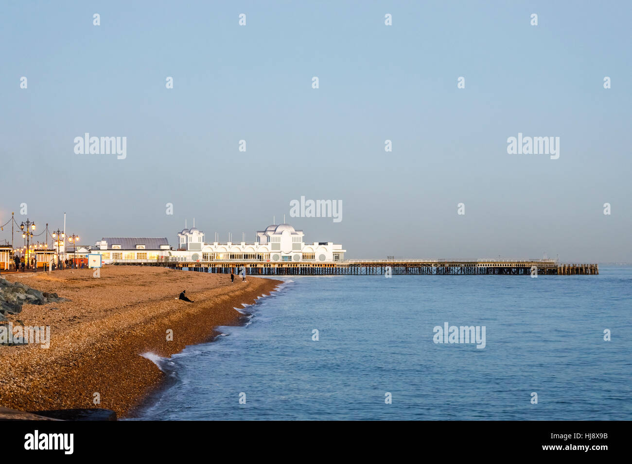 South Parade Pier and the stony beach at Southsea, Portsmouth, Hampshire, southern England in late afternoon/early evening light Stock Photo